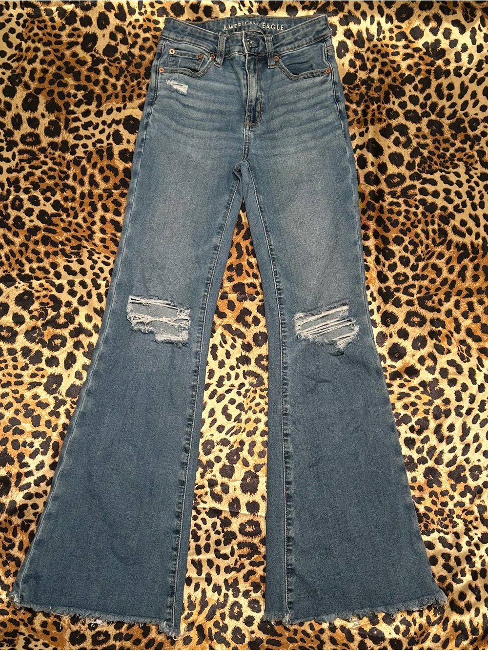 American Eagle Next Level Stretch Flare Distressed Jeans with Raw Hem